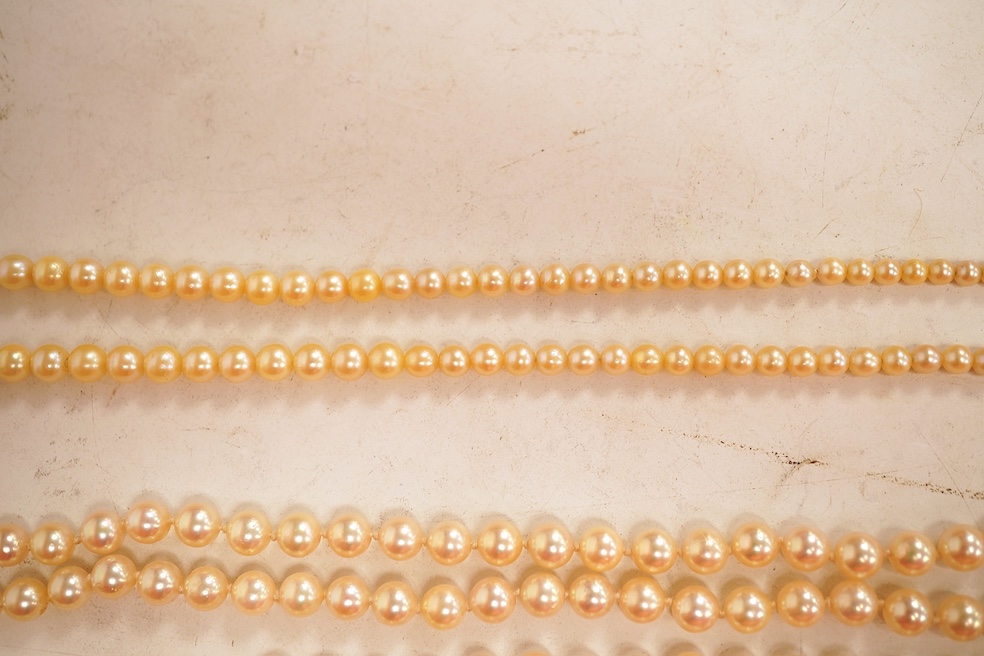Two cultured pearl necklaces, each composed of a single row of cultured pearls, one with pearls 3-7mm diameter, length 44cm, clasp stamped 9CT; the other with pearls approximately 6mm diameter, length 86cm, clasp with Br
